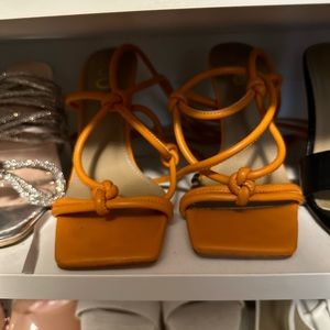Orange strapped heels